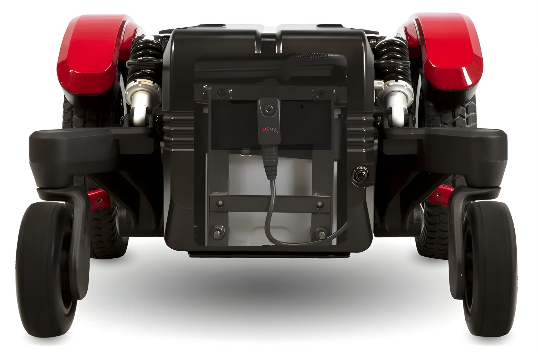 Rear view of the Invacare ROVI X3 power wheelchair showing the OnTraxx Enhanced Driving Module mounted centrally, with visible suspension components and mid-wheel drive configuration designed to improve tracking and stability on uneven surfaces.
