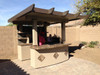 Outdoor Kitchen With Roof and Bar
