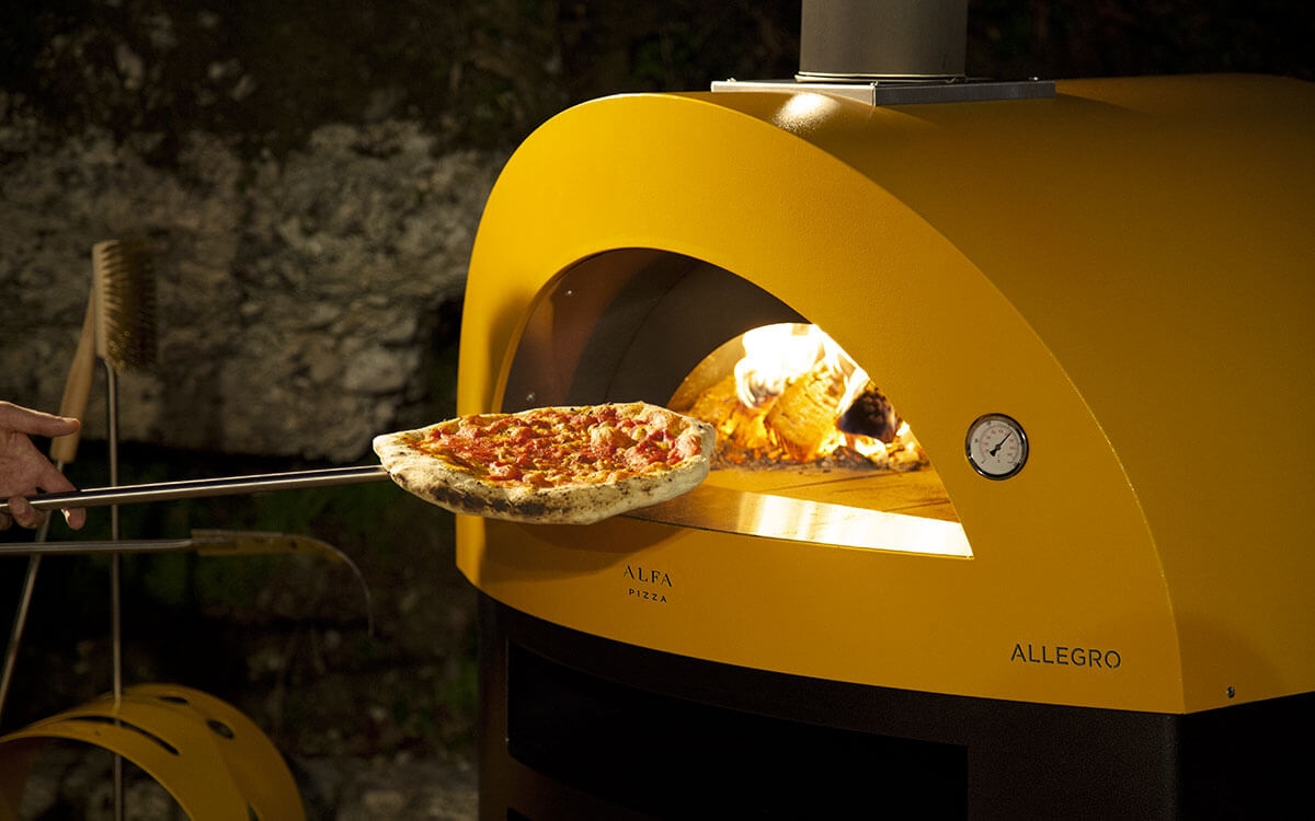 cooking-pizza-wood-fired-pizza-oven-allegro-yellow-color-1200x750.jpg