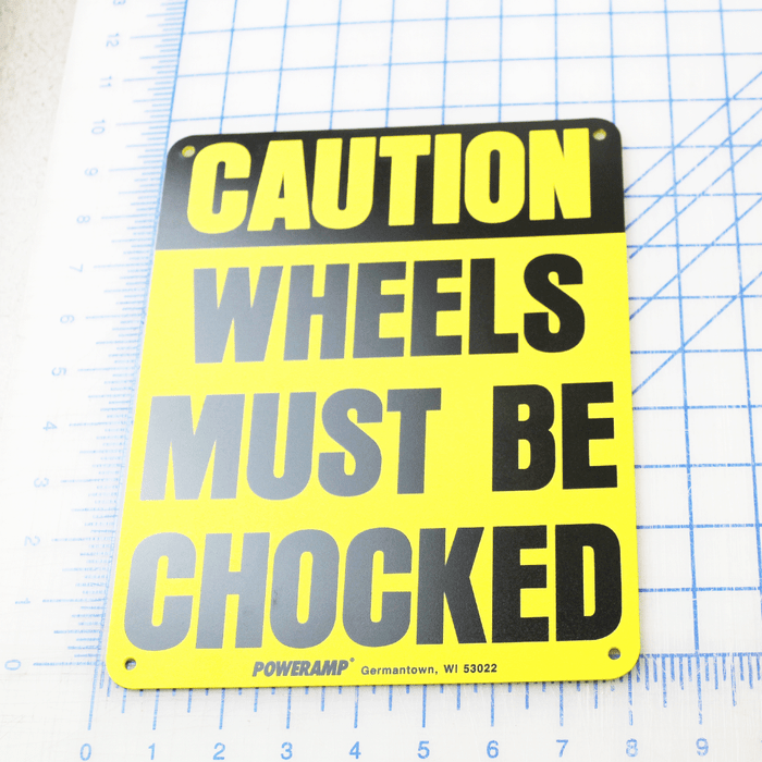 SIGN, WHEELS MUST BE CHOCKED, 10 X 8 X 3/32