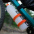 a close up shot of a CNOC ThruBottle with an orange cap attatched to a bike