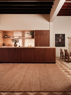 Abaca Herringbone Camel by The Rug Company - roomset image
