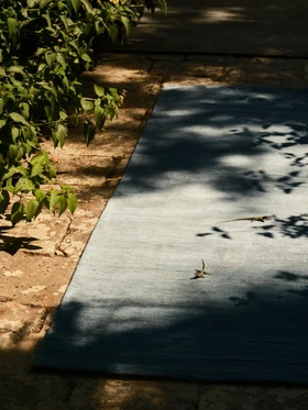 Caliche Silk rug in Aegean, outdoor editorial shot (E1)