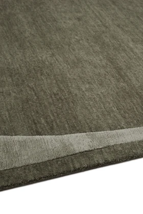 Doma rug in Forest, studio detail shot showing the raised, layered silk border