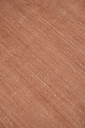 Close-up of Vara rug in Terra, showing silk-wool tactile contrast
