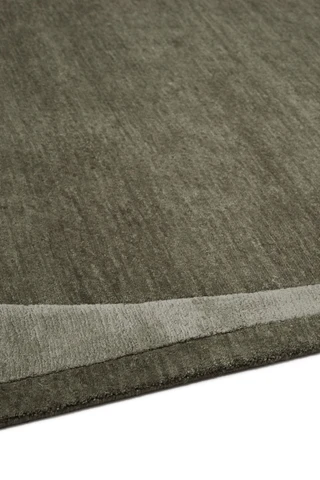 Doma rug in Forest, studio detail shot showing the raised, layered silk border