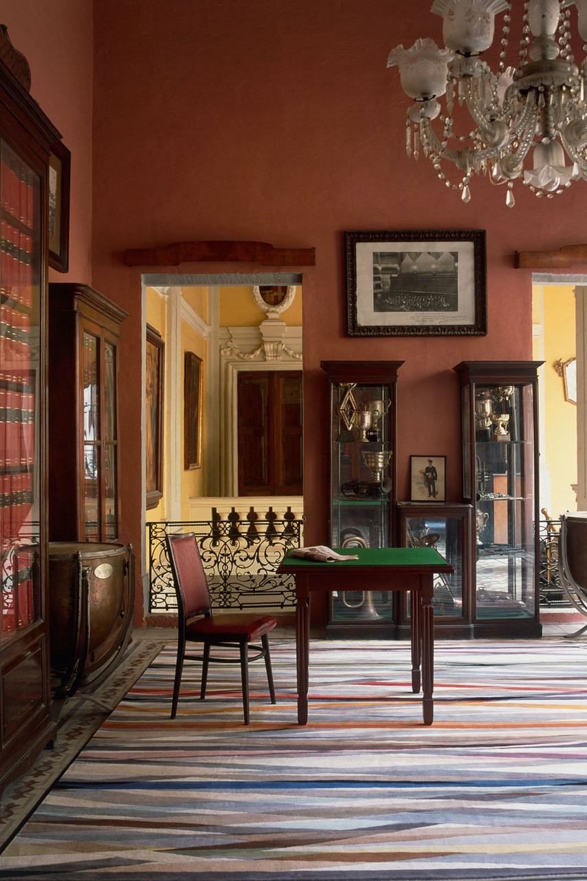 Carnival by Paul Smith - rug in a terracotta coloured room