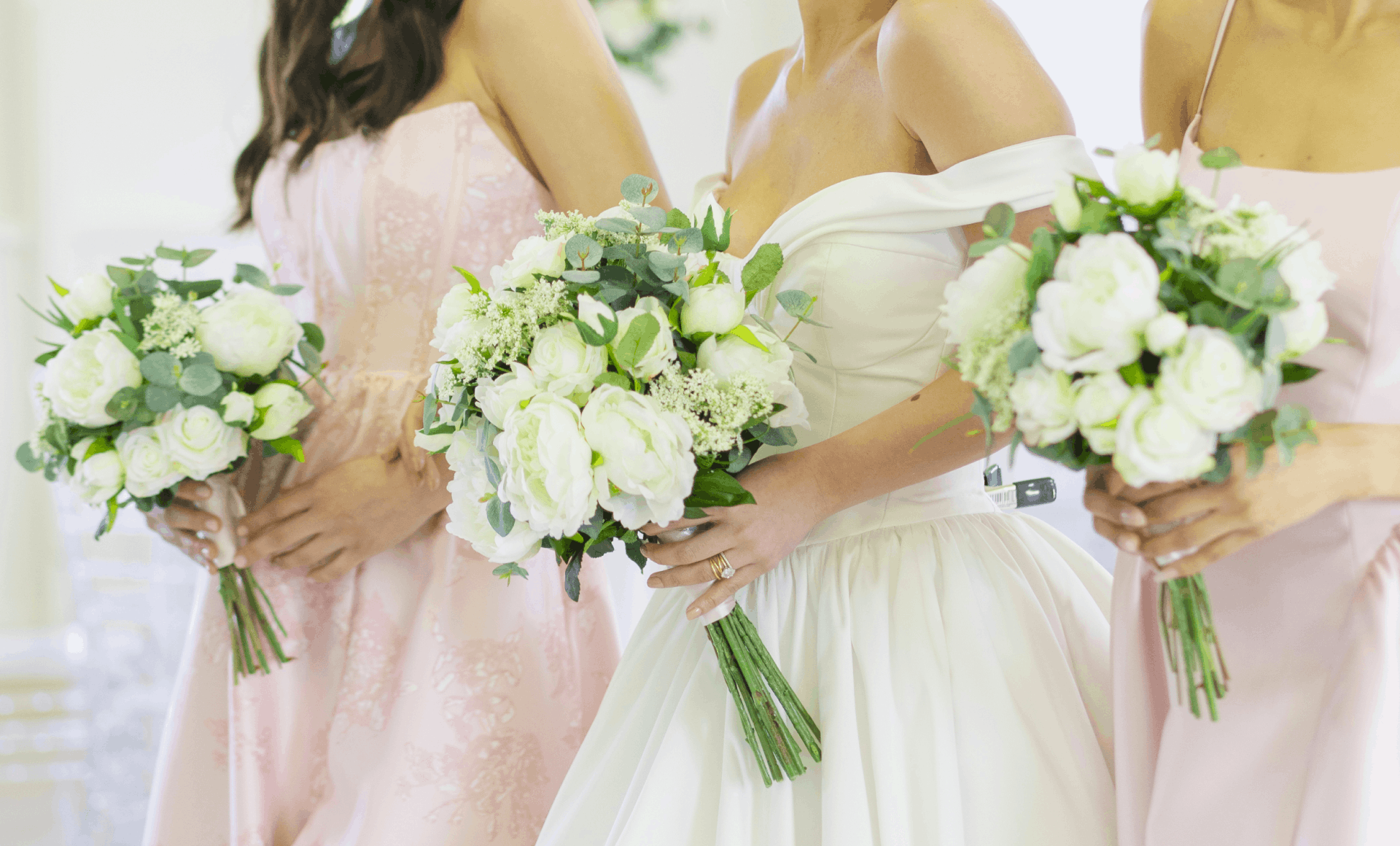 Bridesmaids holding silk flowers from Something Borrowed Blooms