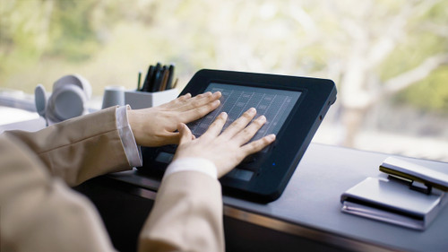 Image: dot pad in use, 2 hands reading