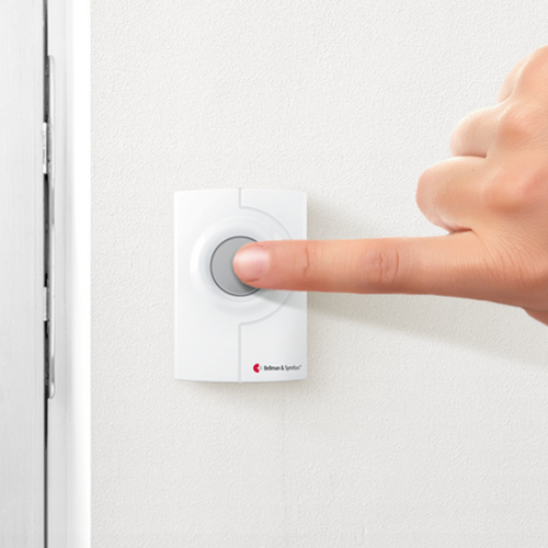 Image: Bellman push button transmitter and pager, in use