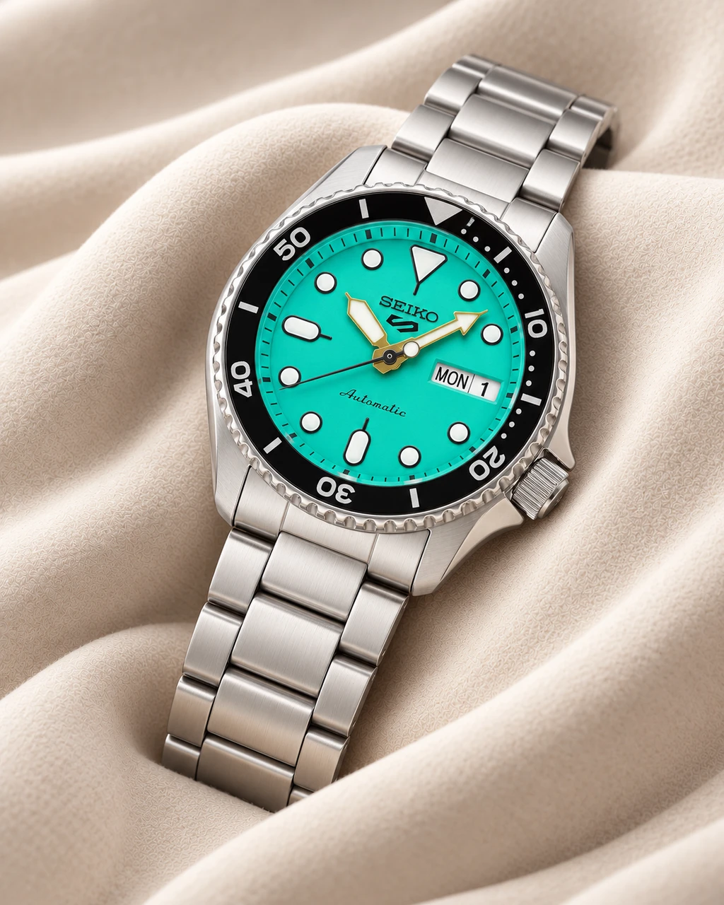 Seiko SRPK33K1 teal dial watch on cream sculpted fabric