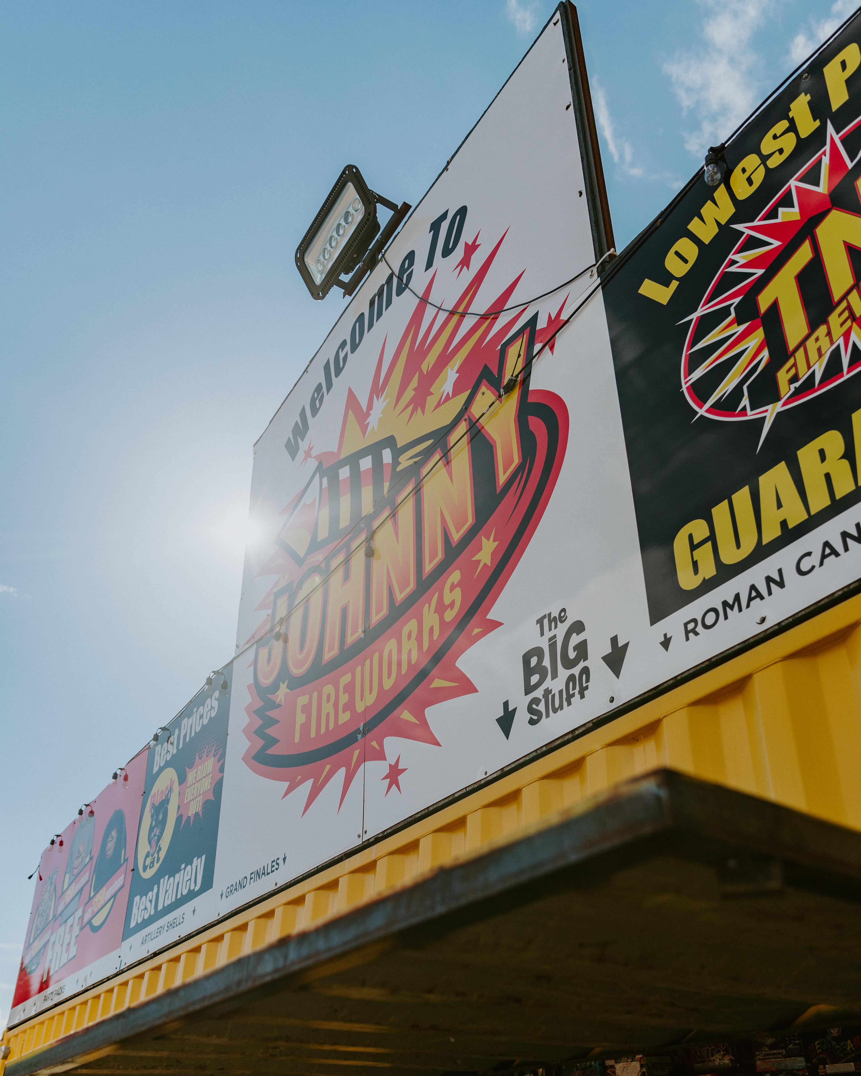 Johnny Fireworks storefront with customers shopping