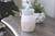DESIGN: Add a dreamy glow to any space with the Iridescent Midsize Illumination Fragrance Warmer the perfect way to fill your home with delicious scents and soft, romantic lighting. This modern and chic warmer features a pearlescent pink and white exterior that illuminates from within, melting wax in the dish on top and surrounding you in fragrance.
FEATURES: Smaller fragrance warmer for small and medium rooms with a removable wax dish for easy wax removal.
USE: Warms fragrance melts and tarts. Roller switch for easy on/off is on the cord. Cord is 3ft long. NP7 bulb (included) can be changed out when bulb wears out.
SPECS: Overall dimensions are 5"X3.5"X3.5". Plug directly into outlet. 120V, 60Hz, 15W. NP7 warming bulb included. Replacement bulb can be purchased separately.