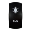 SUN rocker switch with laser-etched sun icon, in daylight
