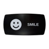 SMILE horizontal rocker switch with laser-etched smiley icon, in daylight