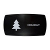 HOLIDAY horizontal rocker switch with laser-etched pine tree icon, in daylight