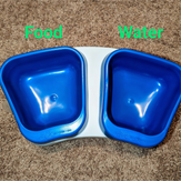 Two sturdy, plastic feeder bowls for dogs or cats