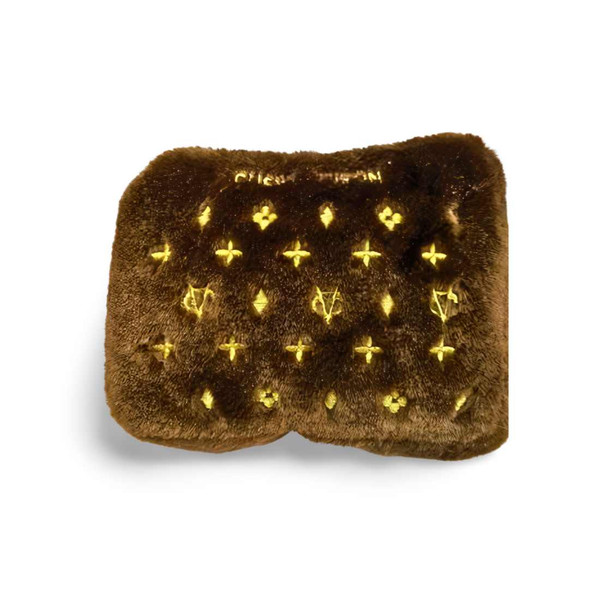Chewy Vuiton squeaky toy dog purse with gold symbols throughout.  Class up any dogs style!