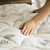 Extra Deep & Plush Rest-Fill® Down Alternative TENCEL™ Cooling Mattress Pad Person pushing on the mattress pad
