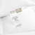 DOWNLITE swd100p EnviroLoft Down Alternative Firm Hotel Pillow label and tag on white pillowcase closeup.
