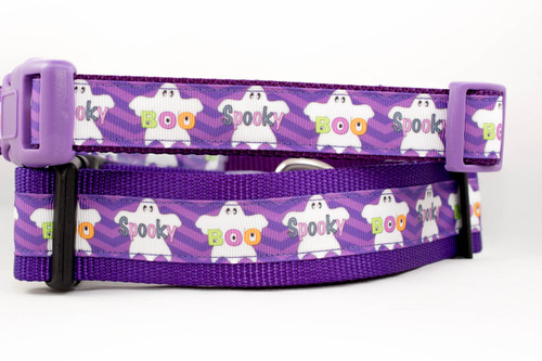 Purple dog collar with a Halloween theme. The collar features a repeating pattern of white ghost figures and the words "Boo" and "Spooky" in colorful letters.