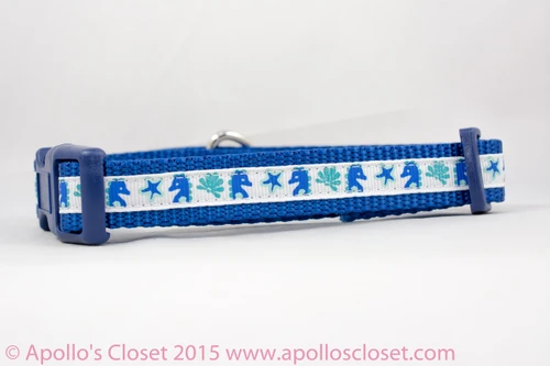 Seahorses, starfish and seashells on a royal blue nylon.