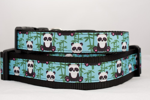 Black nylon collar with pandas on a light blue background with bamboo trees.