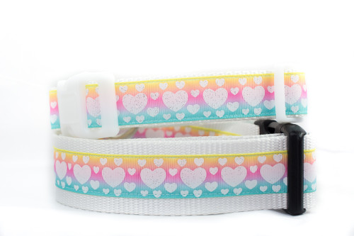 White glittery hearts on a pastel ombre background with white nylon