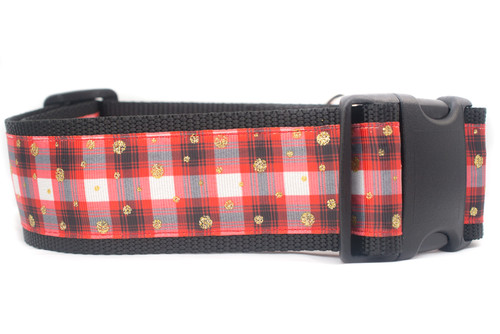 A black dog collar with a red and white plaid ribbon with gold glitter accents.