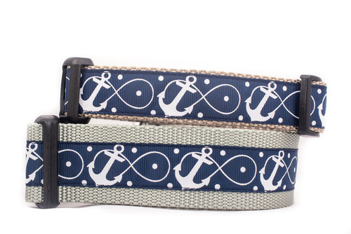 A navy blue dog collar with a white anchor and infinity symbol pattern.