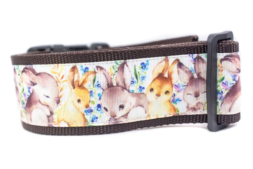 A brown dog collar with a repeating pattern of brown bunnies and small flowers.