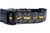 Black dog collar with a pattern of orange jack-o'-lantern faces.
