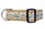 A light blue dog collar with a pattern of a blue pickup trucks carrying pumpkins and sunflowers. 