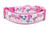 Pink dog collar with a white background featuring a pattern of hearts, kisses, and adorable puppies. 