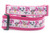 Pink dog collar with a white background featuring a pattern of hearts, kisses, and adorable puppies. 