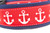 Red glittery anchors on a red ribbon background with 2 inch wide navy blue nylon webbing and black buckle.