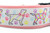 2 inch wide collar with pink nylon and an spring pastel paw print background.