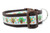 A close-up of a 1.5 inch wide dog collar with a colorful Thanksgiving theme. The collar features a repetitive pattern of small, funky turkeys with brown bodies and vibrant, sparkly tail feathers in orange, green, and blue swirl designs. The collar has brown edges, a brown plastic buckle, and a silver metal D-ring.