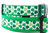 Kelly green dog collar with a scatter of multi-shades shamrocks.  Top is 1 inch wide and bottom is 1.5 inch wide.