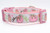 Pink dog collar featuring a white ribbon trim printed with sparkly pink pumpkins, peach pumpkins and vines.