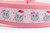 Pink dog collar with a snowflake pattern and santa and bow wearing hippos