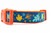Multicolored fall leaves in brown, orange, lime and blue with swirls and dark blue background on an orange nylon.