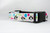 Collar with a New Year's Eve theme.  The collar features penguins wearing party hats, colorful balloons, and confetti.  The text 'Happy New Year' is printed on the collar. 
