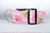 Pink dog collar with a repeating pattern of crabs in pink and green on a white background. 