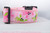 Pink dog collar with a repeating pattern of crabs in pink and green on a white background. 