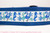 Bright blue assortment of seahorses, flamingos and starfish decorate this blue collar.