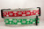 The top collar is red with white snowflakes and the bottom collar is green with white snowflakes.