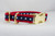 Dog collar with red nylon and a navy American star ribbon trim and brass plated hardware.