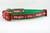 A green and red Christmas-themed dog collar. The collar has a red ribbon with the words "Naughty" and "Nice" in white. 
