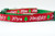 Red and green Christmas cat collar with the words "Naughty" and "Nice" printed on it.